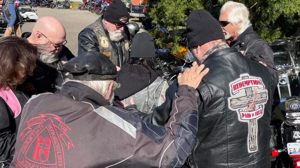 motorcycle riders exchange bells when Angie gets her bike blessed by Redemption Paid in Full Riding Group - bulk motorcycle bells