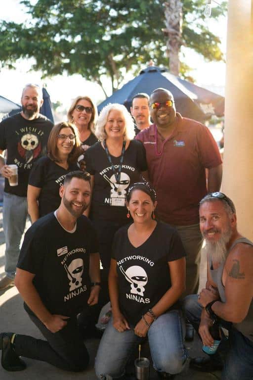 bikers laughing and sharing stories at a post-ride BBQ, showing strong community bonds - biker fundraising events
