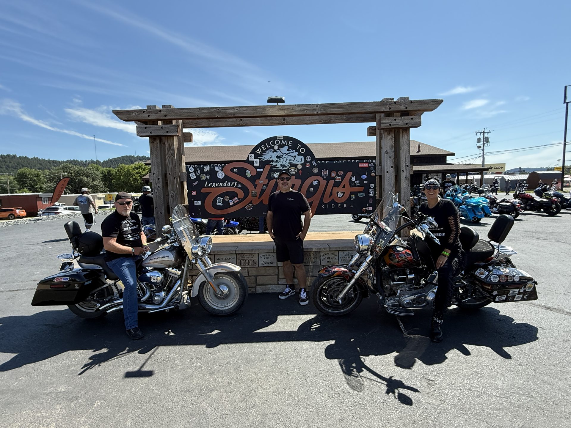 Welcome to Sturgis sign with motorcycles - sturgis 2025 lodging