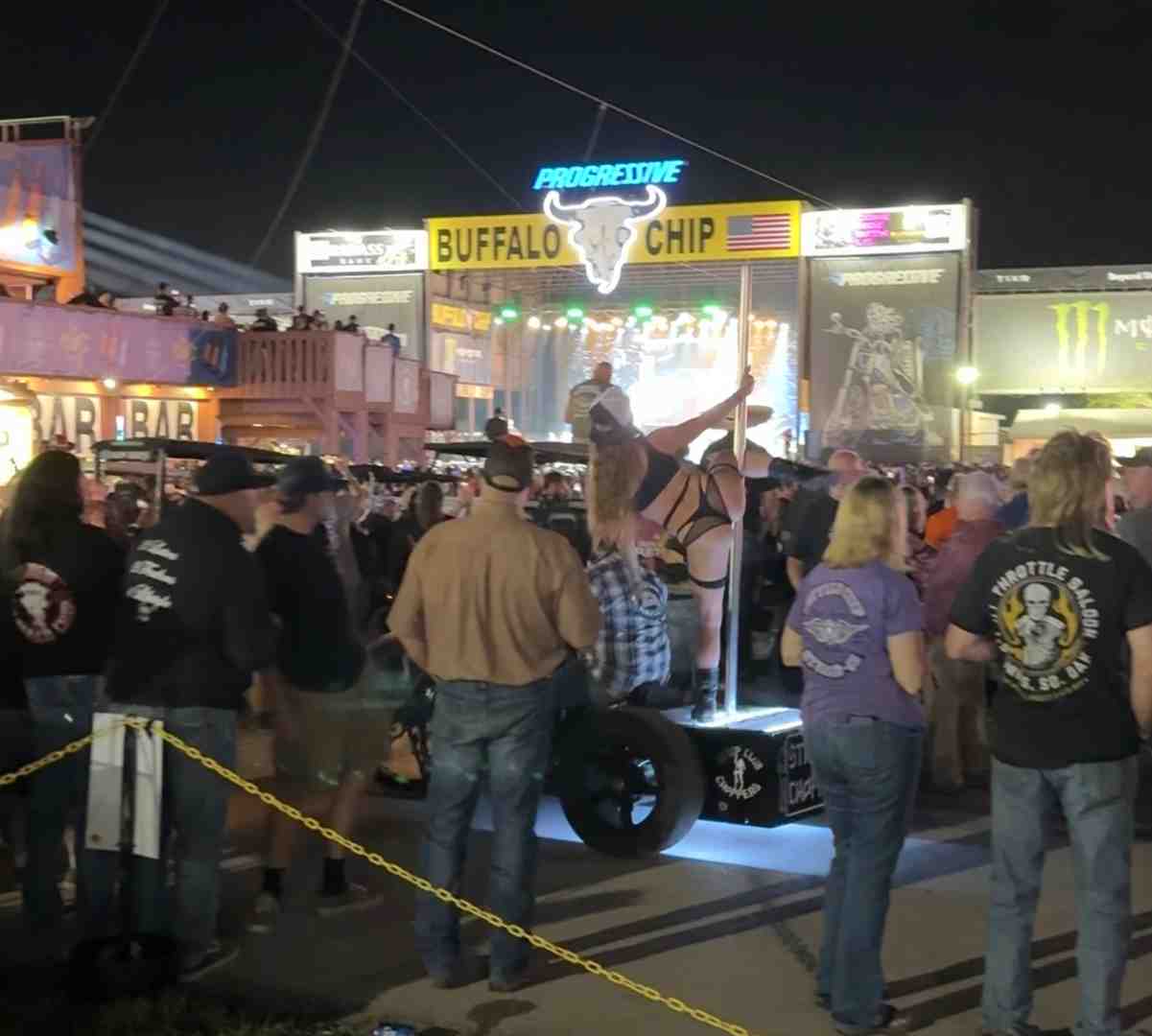 A band performing on the Sturgis Buffalo Chip stage at night with a large crowd - What happened at sturgis rally 2025