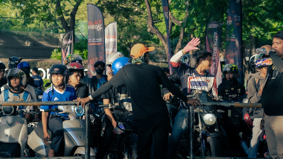 Custom bagger at motorcycle rally with crowd of admirers - custom bagger builders near me